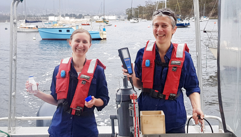Derwent Estuary Program scientists Dr Bernadette Proemse (left) and Inger Visby (right) measuring water quality in the Derwent Estuary, Tasmania. (Photo from Derwent Estuary Program)