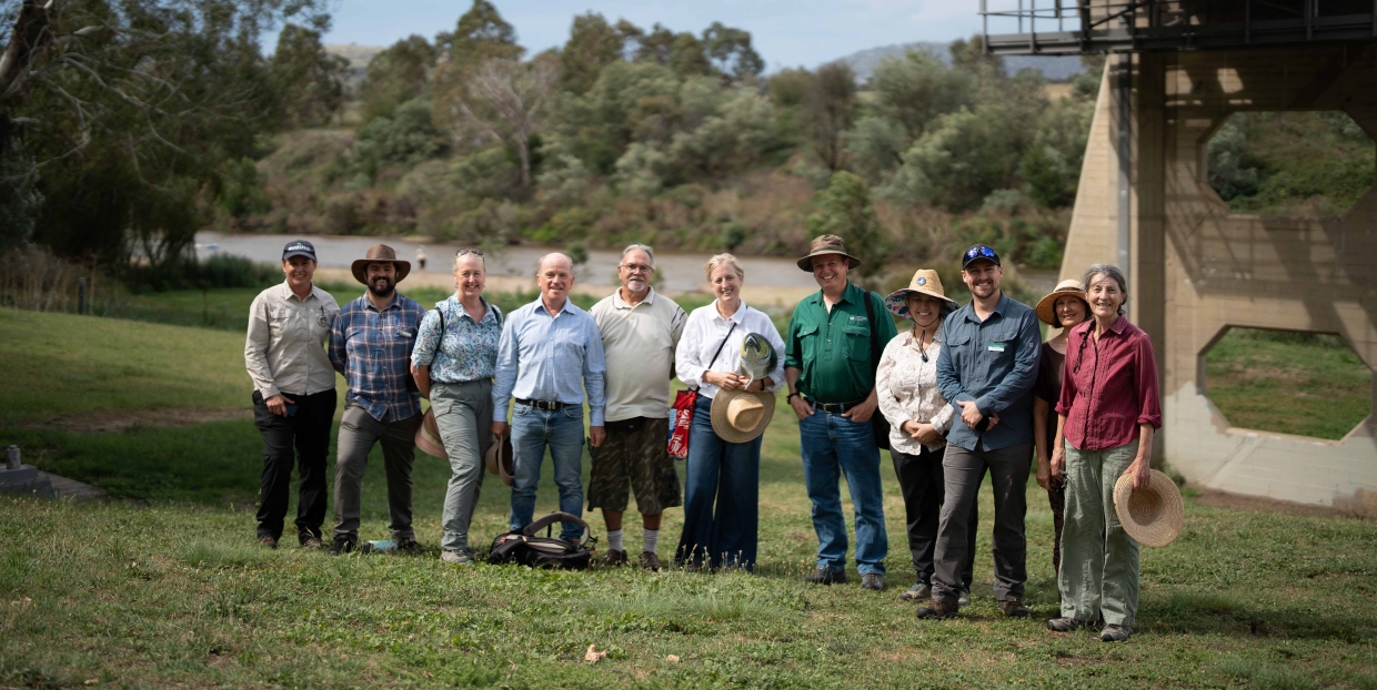 Group of people beside the Murrumbidgee River at Tharwa Bridge