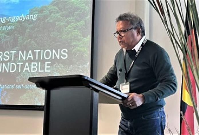 Yawuru man, ANU Vice-President, Prof Peter Yu AM, standing at a lectern opening the second roundtable