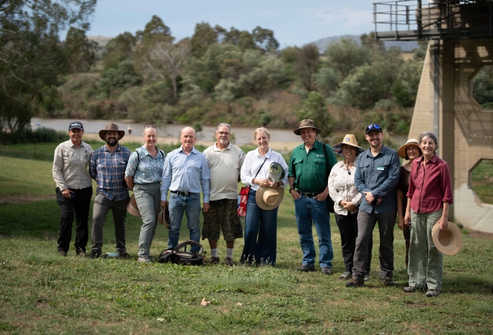 Group of people beside the Murrumbidgee River at Tharwa Bridge